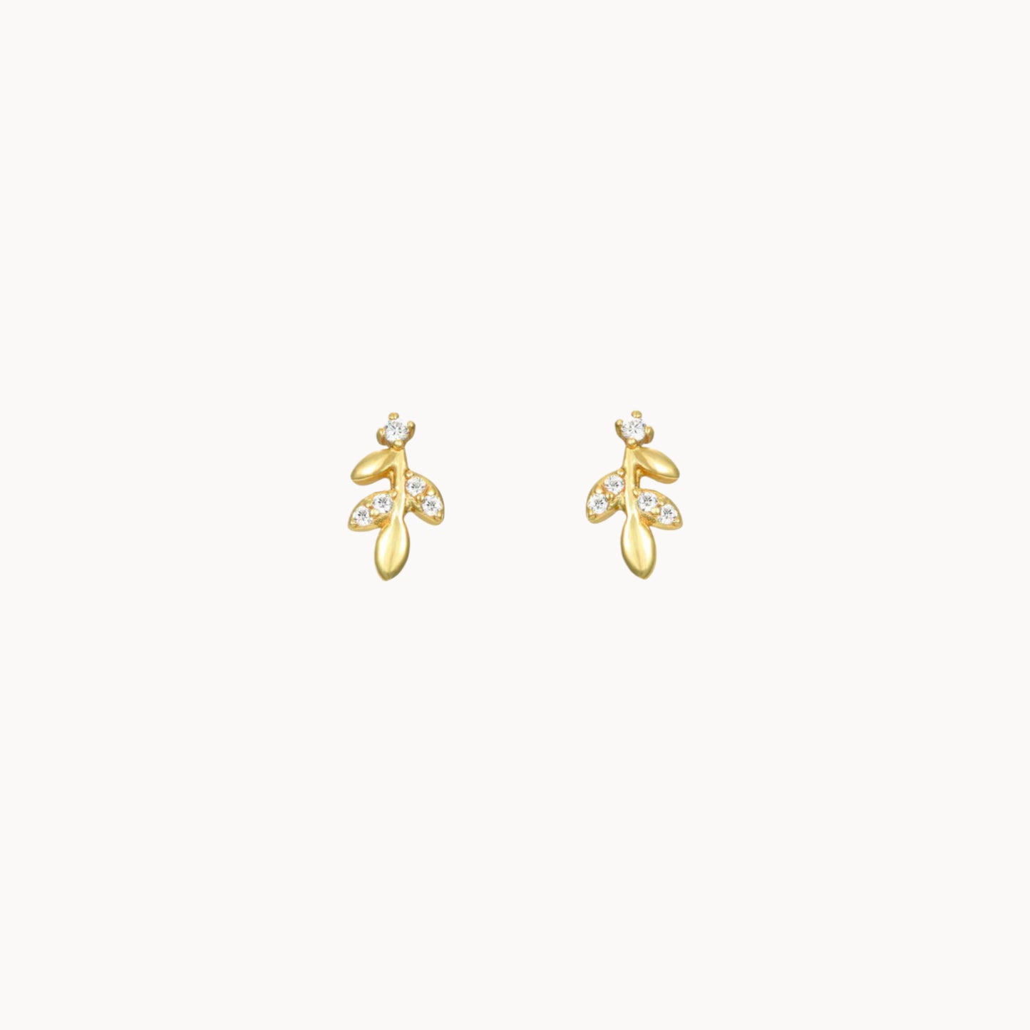 Petites puces d'oreilles motif feuilles avec zircons